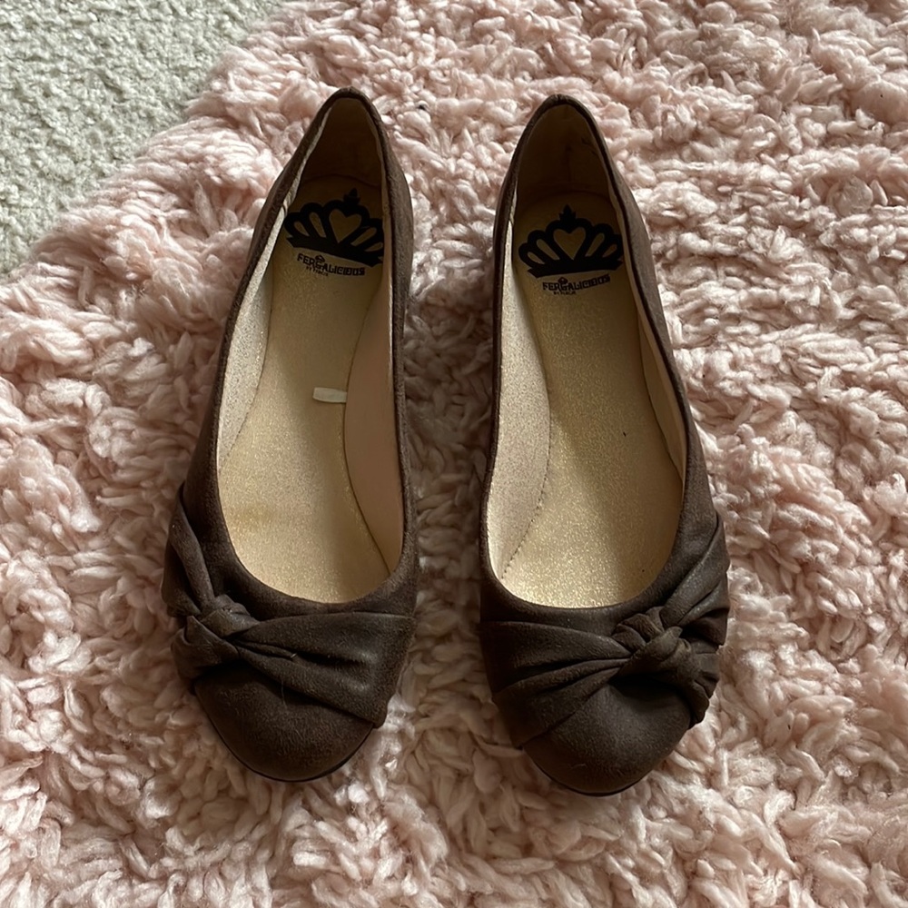 Brown Fergalicious suede shoes.